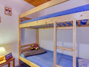 a bunk bed room with two bunk beds in a house at Apartment Ariane-3 by Interhome in Le Corbier