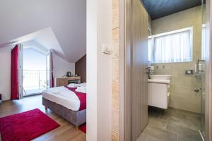 Posteľ alebo postele v izbe v ubytovaní Hotel Vicko