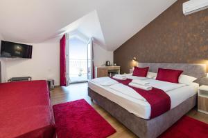 Posteľ alebo postele v izbe v ubytovaní Hotel Vicko