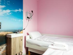 Ένα ή περισσότερα κρεβάτια σε δωμάτιο στο Apartment Buntspecht - G 25 by Interhome
