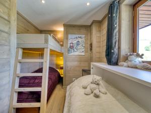 a bedroom with a bunk bed and two beds at Apartment Apollo-4 by Interhome in Le Corbier