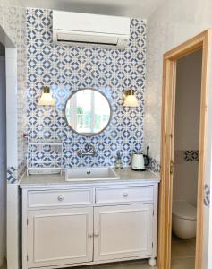 a bathroom with a sink and a mirror at Mont Astral in Monchique