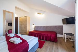 Posteľ alebo postele v izbe v ubytovaní Hotel Vicko