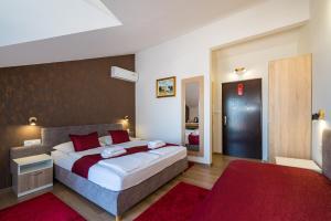 Posteľ alebo postele v izbe v ubytovaní Hotel Vicko