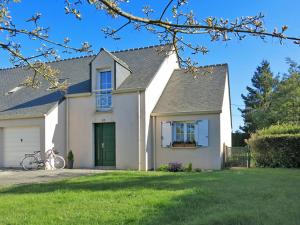 a white house with a bicycle parked in front of it at Holiday Home Ar Mimoza by Interhome in Le Bono +20 photos