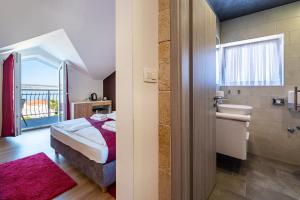 Posteľ alebo postele v izbe v ubytovaní Hotel Vicko