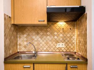 a kitchen with a sink and a stove at Apartment B212 by Interhome in Lahnstein