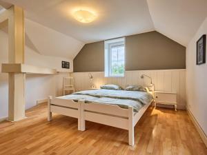 a bedroom with a bed and a window at Villa Svoboda na Úpou by Interhome in Svoboda nad Úpou