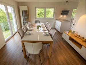 a dining room with a long table and chairs at Holiday Home Schwarzwald by Interhome in Dittishausen