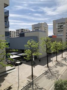 a view of a city with trees and buildings at Dolcevita Locarno in Locarno
