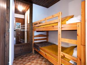 a bunk room with two bunk beds in a cabin at Studio Le Bionnassay by Interhome in Les Contamines-Montjoie