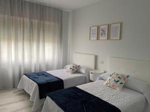 Ένα ή περισσότερα κρεβάτια σε δωμάτιο στο A Xaneiriña