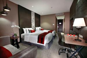 Postel nebo postele na pokoji v ubytování Aston Priority Simatupang Hotel and Conference Center