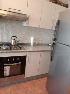 Kuchyň nebo kuchyňský kout v ubytování Résidence Bab Sebta