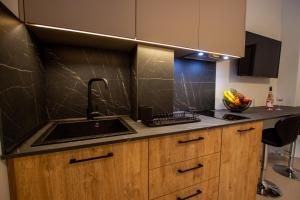 a kitchen with a sink and a counter top at Haus Riviera in Asprovalta