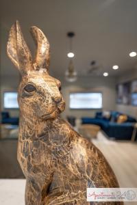 a statue of a rabbit in a living room at Beautiful Apartment In London in Hounslow