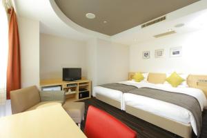 Postel nebo postele na pokoji v ubytování HOTEL MYSTAYS Utsunomiya
