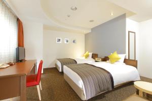 Postel nebo postele na pokoji v ubytování HOTEL MYSTAYS Utsunomiya