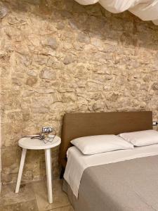 A bed or beds in a room at Altrelli Rooms