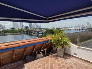 a balcony with a view of a river at Casa Marqués del Pedregal in Cartagena de Indias