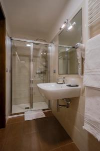 a bathroom with a sink and a shower at Hotel Velino in Avezzano