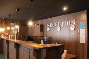 a restaurant with a counter with clocks on the wall at Alpine luxury two bed-two bathrooms apartment B25 in Borovets