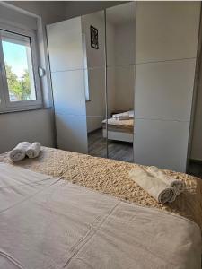 Postel nebo postele na pokoji v ubytování Apartmani Vuković