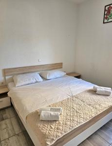 Postel nebo postele na pokoji v ubytování Apartmani Vuković