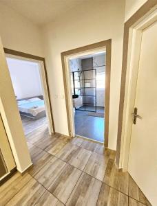 Postel nebo postele na pokoji v ubytování Apartmani Vuković