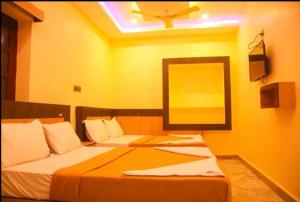 Voodi või voodid majutusasutuse SREE Kumaran Residence toas