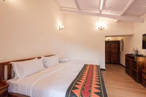 Postel nebo postele na pokoji v ubytování Ibex Resorts, Coonoor Leewood