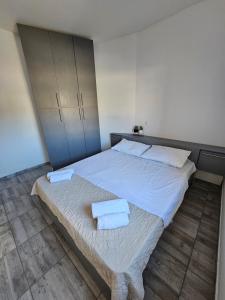 Postel nebo postele na pokoji v ubytování Apartmani Vuković