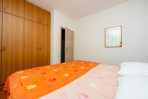 Postel nebo postele na pokoji v ubytování Apartmani Azur