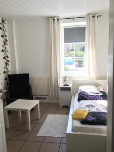Ein Bett oder Betten in einem Zimmer der Unterkunft Schlafen in Rosengarten