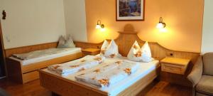 Postel nebo postele na pokoji v ubytování Pension Berghof