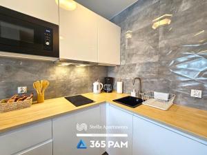 Køkken eller tekøkken på Nadmorskie Apartamenty - 365PAM