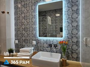 Et badeværelse på Nadmorskie Apartamenty - 365PAM