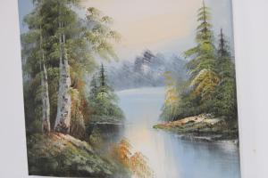 a painting of a river in a forest at Deni Family Apartament in Tirana