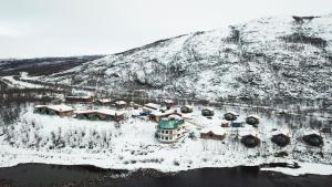 an aerial view of a resort in the snow at Utsjoki Arctic Resort in Utsjoki +58 photos