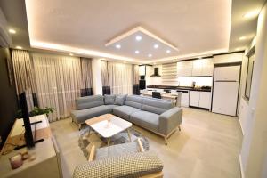 a living room with a couch and a table at Mayda Suit Aparts in Kas