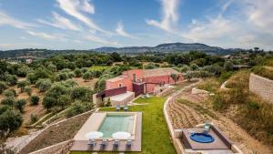 an aerial view of a villa with a swimming pool at VILLA SUMAC 6, Emma Villas in Sortino
