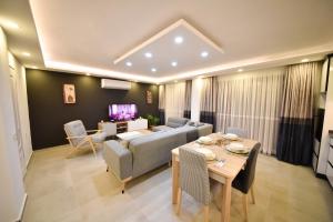 a living room with a couch and a table at Mayda Suit Aparts in Kas