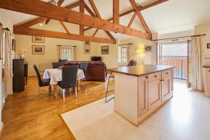 a kitchen and living room with a table and chairs at Host & Stay - Widger Mews Apartment in Norton