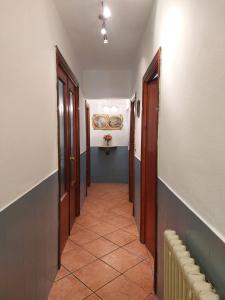 a hallway with doors and a tile floor in a building at Mallona 