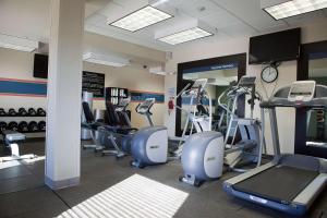 a gym with a bunch of treadmills and machines at Hampton Inn Colby in Colby