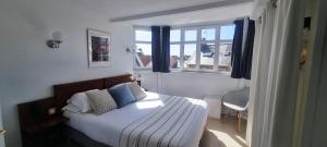 Cama ou camas em um quarto em Hotel De L'Europe