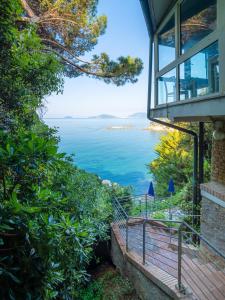 a view of the ocean from a house at Hotel Il Nido in Tellaro