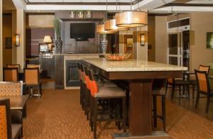 a large kitchen with a large island in a hotel room at Hampton Inn Cedar City in Cedar City