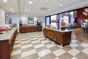 a large kitchen with a checkered floor at Hampton Inn & Suites Chino Hills in Chino Hills