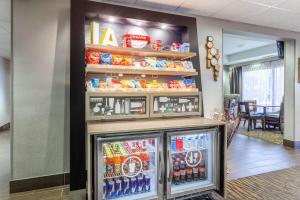 a soft drink refrigerator in a lobby at Hampton Inn Cedar Rapids in Cedar Rapids